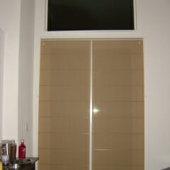 two-on-one-headrail-roman-shade-over-sliding-glass-door