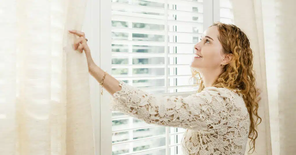 Smiling woman looking out window Timing is Everything