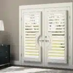 hunter-douglas-heritance-custom-wood-door-shutters-bedroom
