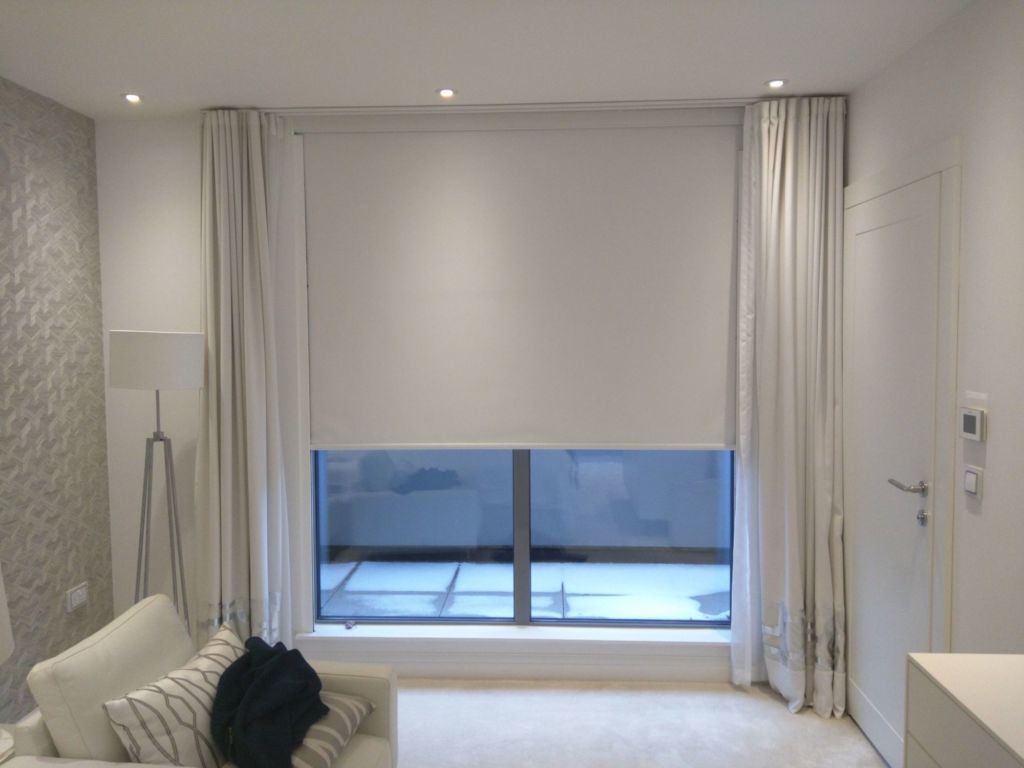 Blackout roller shades with sidetrack and drapes