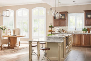 Faux wood shutters are the perfect solution for kitchens as they offer granular light control and complete privacy.