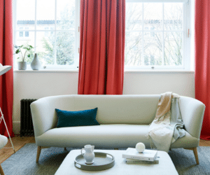 Living room window with curtain draped.