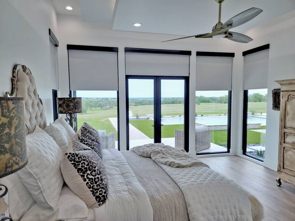 Luxury bedroom with blackout shades for better sleep
