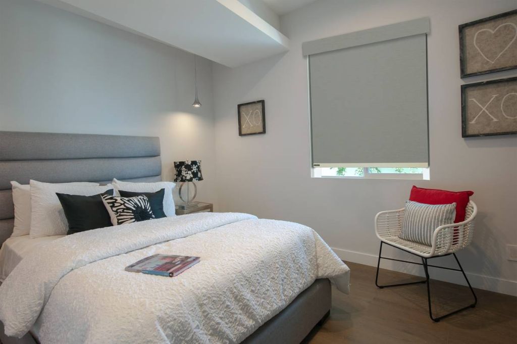 Bedroom with Soluna roller blackout shade and light guard for full light blocking.