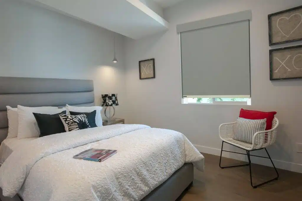 roller-shade-light-guard Bedroom with Soluna roller blackout shade and light guard for full light blocking.